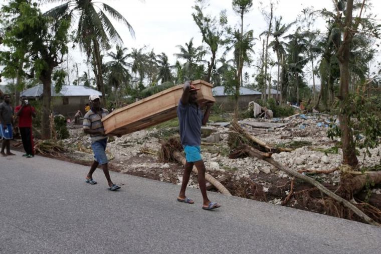 Men carry a coffin after Hurricane Matthew hit Cavaillon, Haiti, October 6, 2016.