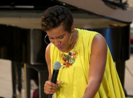Pastor Desireé Allen of First Corinthian Baptist Church preaching in September. She is 5 1/2 months pregnant in this photo.
