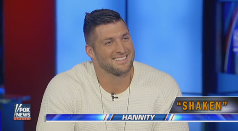 Tim Tebow speaks about his new book, "Shaken" with Fox News host Sean Hannity in New York City on November 28, 2016.