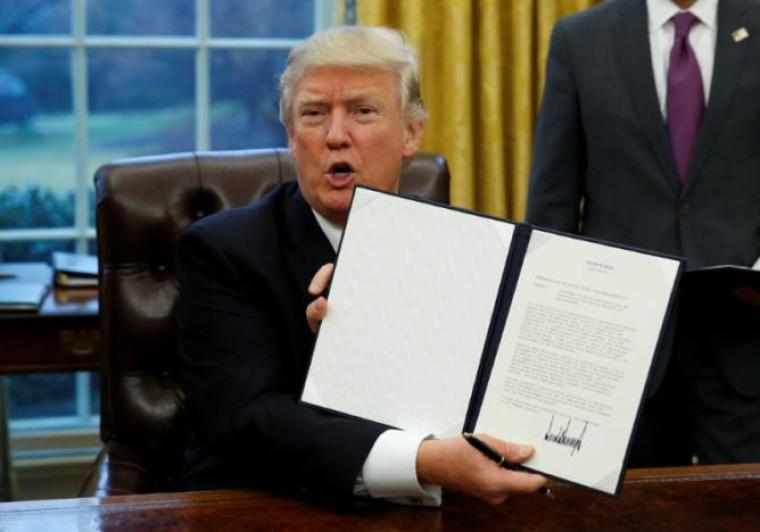 President Donald Trump signs TPP Withdrawal