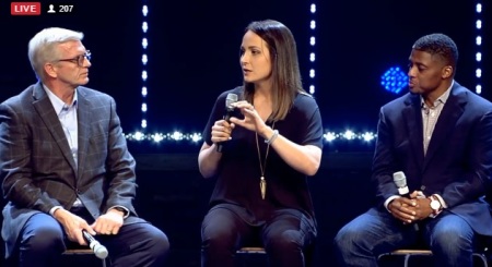 Former Louisiana State University soccer standout Mo Isom (M) speaks at the "Under Our Skin" forum on race and faith hosted at The Crossing Church in Tampa, Florida on Feb. 16, 2017. Isom is flanked by former NFL running back Warrick Dunn (R) and Detroit pastor J. Kevin Butcher (L)