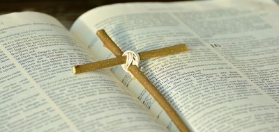 Cross on Bible