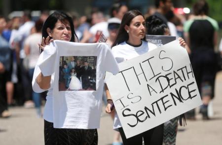 Chaldean-Americans protest against the seizure of family members Sunday by Immigration and Customs Enforcement agents during a rally outside the Mother of God Chaldean church in Southfield, Michigan, U.S., June 12, 2017.
