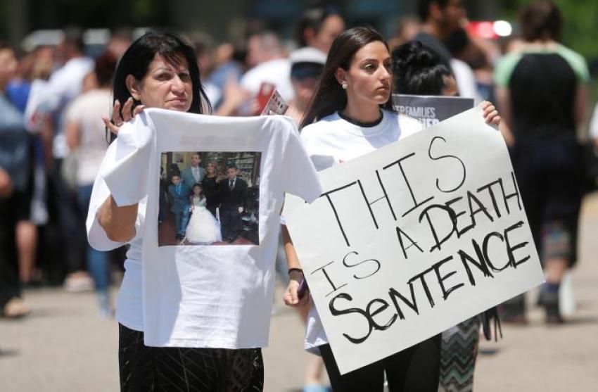 Chaldean-Americans protest against the seizure of family members Sunday by Immigration and Customs Enforcement agents during a rally outside the Mother of God Chaldean church in Southfield, Michigan, U.S., June 12, 2017.