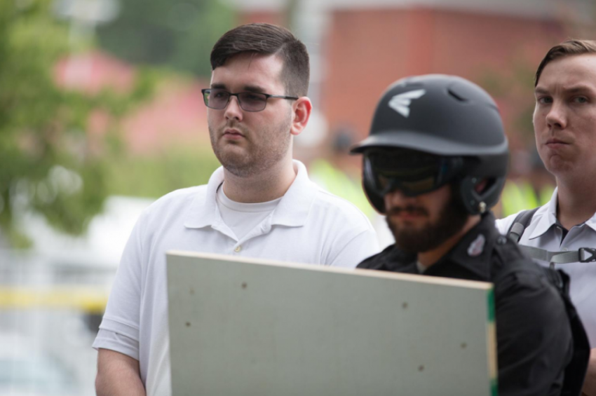 James Alex Fields Jr., (L) is seen attending the "Unite the Right" rally in Emancipation Park before being arrested by police and charged with charged with one count of second degree murder, three counts of malicious wounding and one count of failing to stop at an accident that resulted in a death after police say he drove a car into a crowd of counter-protesters later in the afternoon in Charlottesville, Virginia, U.S., August 12, 2017.