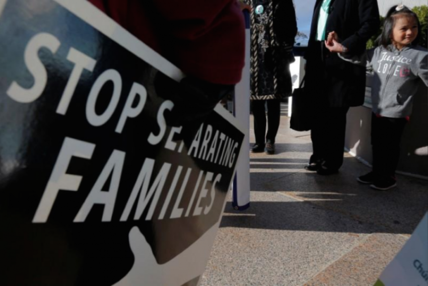 Demonstrators holding an "Interfaith Prayer Vigil for Immigrant Justice" talk to ethnic Chinese Christians who fled Indonesia after wide scale rioting decades ago and overstayed their visas in the U.S., following their family meeting, including their five year-old daughter (R), with ICE, in Manchester, New Hampshire, U.S., October 13, 2017.