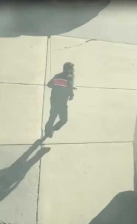 Suspected driver of the pickup truck that mowed down pedestrians and cyclists on a bike path alongside the Hudson River runs after the attack in the middle of a road, in New York City, NY, U.S., in this still image from a video obtained from social media October 31, 2017.