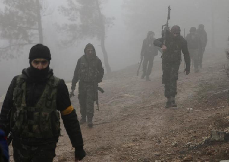 Turkish-backed Free Syrian Army fighters are seen near Mount Barsaya, northeast of Afrin, Syria, January 23, 2018.