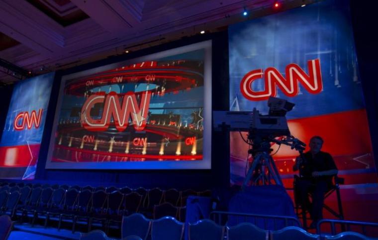 A CNN camera operator waits by his camera as the network prepares for the first democratic presidential candidate debate at the Wynn Hotel in Las Vegas, Nevada October 13, 2015. | REUTERS/Mike Blake