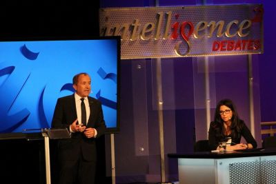 Michael Shermer (L), founder of The Skeptics Society and his debate partner Heather Berlin, a cognitive neuroscientist (R) explain why "The More We Evolve, the Less We Need God" at an Intelligence Squared debated in New York City on March 27, 2018.