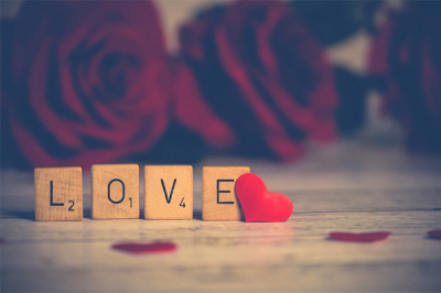 The word "Love" spelled out in Scrabble letters.