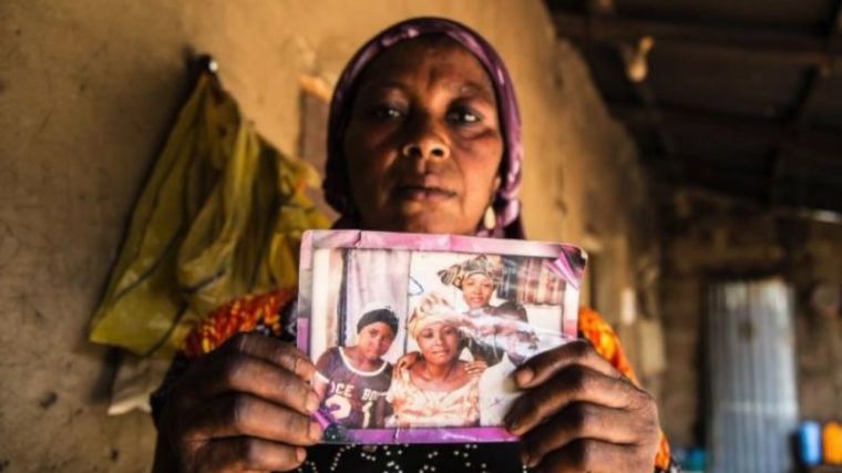 A photo of Christian schoolgirl Leah Sharibu's family is held in Nigeria in a September 2018 video. | YouTube/International Christian Concern