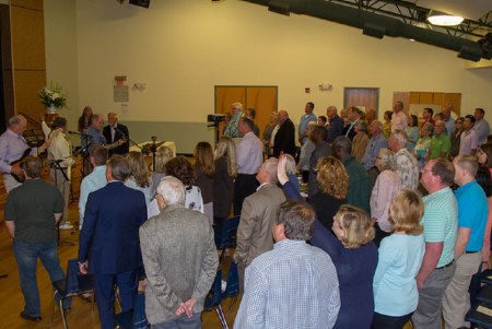Congregants of Redeemer Fellowship of Edisto Island participate in a worship service in April 2018 in Edisto Beach, South Carolina.