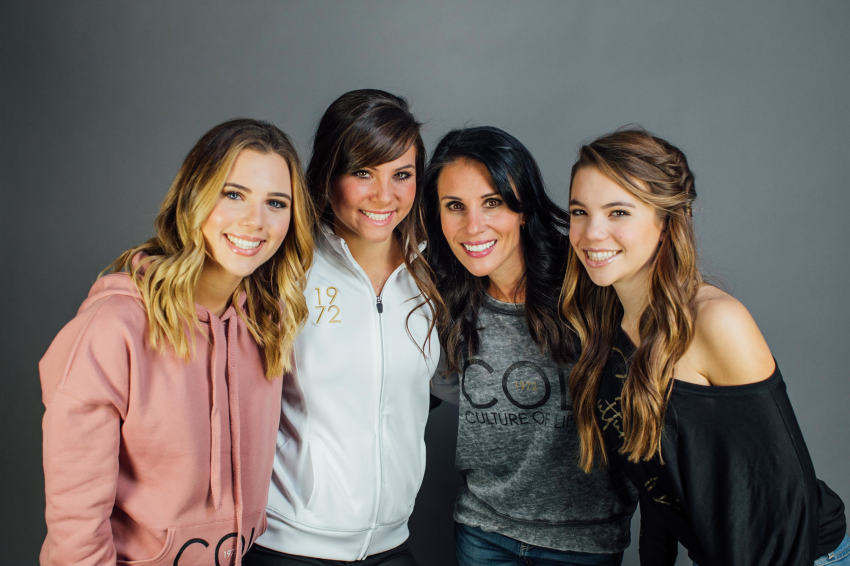 Carla D'Addesi (center-right) and her three daughters pose in COL 1972 clothing.