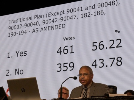The Rev. Joe Harris presides over the legislative committee while the results of a vote approving the Traditional Plan as amended by 461-359 are displayed. The vote still needed to be approved by the plenary session on Feb. 26, the final day of the special session of the 2019 General Conference of The United Methodist Church in St. Louis, Missouri.
