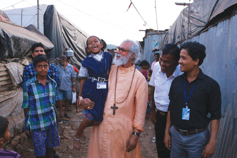 Gospel for Asia founder K.P. Yohannan greets people in Mumbai, India in February 2018. | Courtesy of Gospel for Asia
