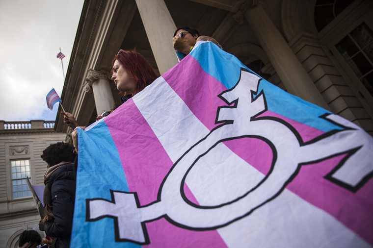 LGBT activists and their supporters rally in support of transgender people on the steps of New York City Hall, in New York City, October 24, 2018. | Getty Images/Drew Angerer