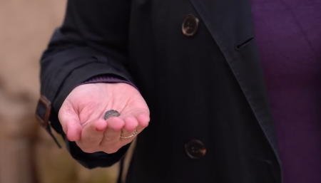 Dr. Anat Mendel-Geberovich holds a bulla from the 8th century BC, that includes a reference to Nathan-Melech, who was identified as “Servant of the King.”