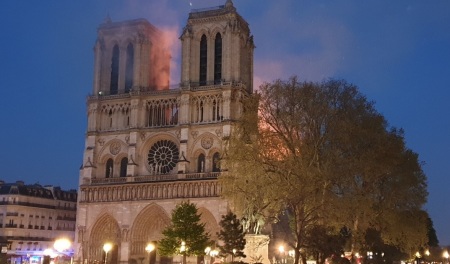The Notre Dame Cathedral of Paris, France experiencing a major fire on Monday, April 15, 2019.