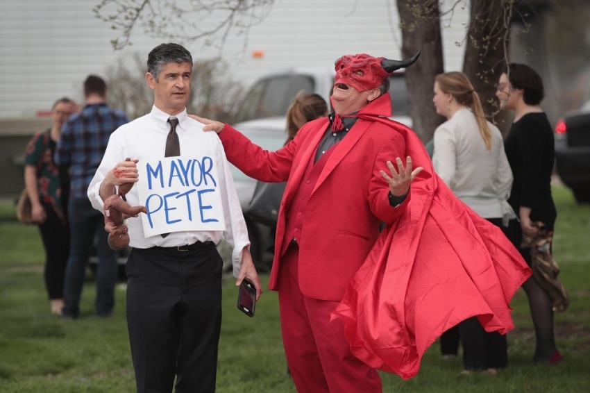 DES MOINES, IOWA - APRIL 17: Anti-gay and pro-life demonstrators, Gary Boisclair (L) and Randall Terry, with The Society for Truth and Justice, protest outside of a campaign event hosted by Democratic presidential candidate and South Bend, Indiana Mayor Pete Buttigieg on April 17, 2019 in Des Moines, Iowa. Buttigieg is on his first visit to the state since announcing that he was officially seeking the Democratic nomination during a rally in South Bend on April 14.
