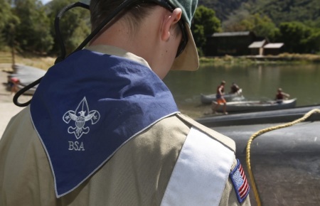 A Boy Scout works on a canoe at camp Maple Dell on July 31, 2015 outside Payson, Utah.