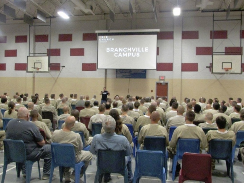 Inmates attend a "Church Anywhere" service run by volunteers affiliated with First Capital Christian Church at the Branchville Correctional Facility in Branchville, Indiana.