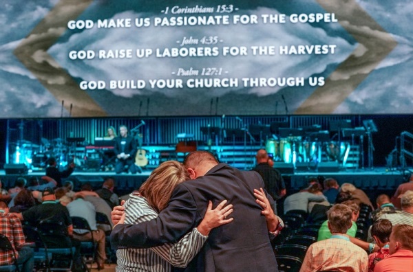 J.D. Greear, president of the Southern Baptist Convention (SBC), leads a prayer for the upcoming SBC annual meeting June 11-12, 2019, during the last session of the two-day 2019 SBC Pastors' Conference at the Birmingham-Jefferson Convention Complex in Birmingham, Ala. Groups of attendees gathered together to pray in small groups.