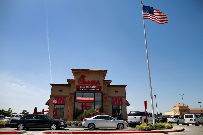 Drive through customers wait in line at a Chick-fil-A restaurant on August 1, 2012 in Fort Worth, Texas.