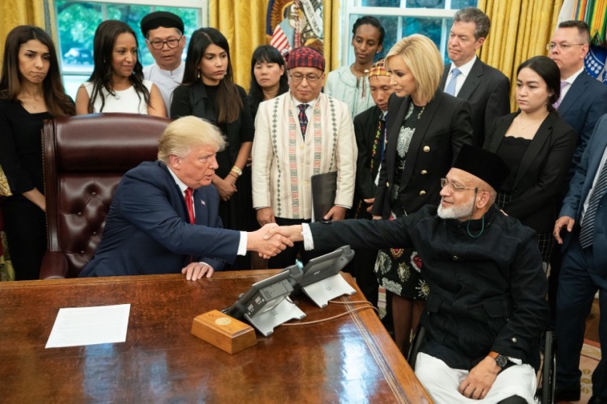 President Donald Trump shakes the hand of New Zealand mosque shooting survivor Dr. Farid Ahmed during a meeting at the White House with 27 survivors of religious persecution in Washington, D.C. on July 18, 2019.