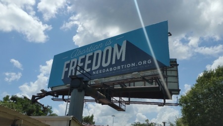 A billboard put up by pro-choice groups in July 2019 outside of Waskom, Texas, whose city council had passed a resolution labeling the area a "Sanctuary for the Unborn."
