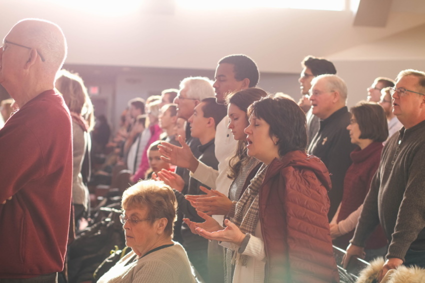 People worshiping God inside church.