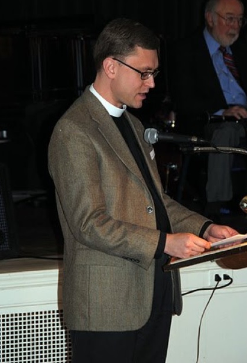 The Reverend Gregory Lisby of Christ Church gives an invocation at a Community Meals, Inc. event in 2011.