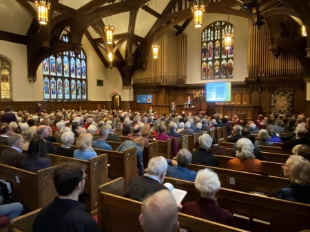 A meeting at Plymouth Congregational Church of Minneapolis, Minnesota, to decide whether to keep a large embroidery banner known as "Churchmen in the New World" on display. The church voted on Nov. 10, 2019, to remove the tapestry, which had been on display at the church since 1974. 
