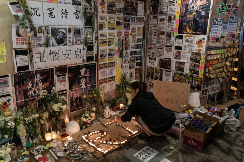 A woman pays her respect to 22-year-old student Alex Chow who fell during a recent protest on November 10, 2019, in Hong Kong, China.