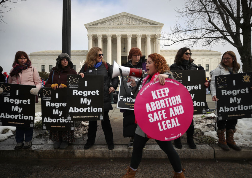 Protesters on both sides of the abortion issue gather in front of the U.S. Supreme Court building during the Right To Life March, on January 18, 2019, in Washington, D.C.
