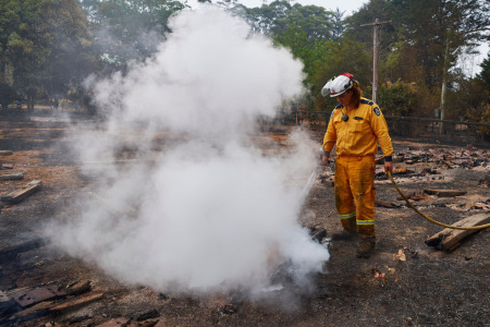 An RFS Crew attempts to put out a smoldering pile of railway sleepers. The sleepers measured over 600 degrees on a thermal temperature gauge 2 days after the fire front had passed through on January 06, 2020, in Wingello, Australia. Cooler conditions and light rain has provided some relief for firefighters in NSW who continue to battle bushfires across the state. Army Reserve forces and other specialist capabilities have been called in to help with firefighting efforts across Australia, along with extra Defence ships and helicopters. 
