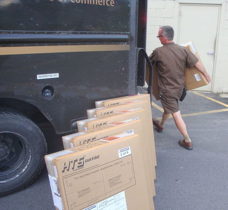 A UPS driver makes a delivery.
