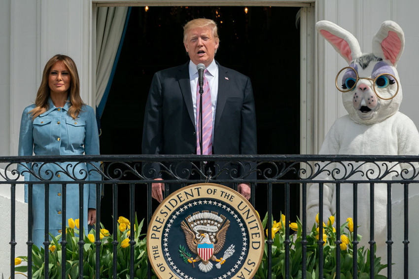 President Donald J. Trump, joined by First Lady Melania Trump, delivers remarks on the Blue Room balcony of the White House as they welcome guests Monday, April 22, 2019, to the 141st White House Easter Egg Roll.
