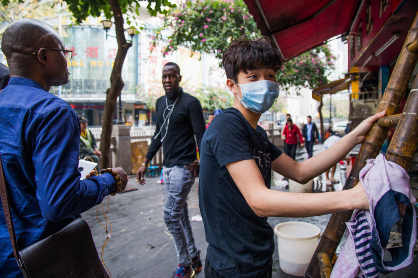 African men walk near Little North Road, part of an ethnically diverse quarter of Guangzhou known as Little Africa on February 3, 2019, in Guangzhou, China.