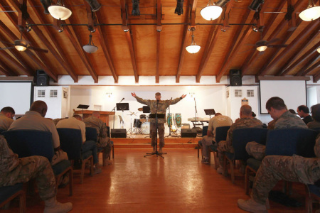 Protestant U.S. Army chaplain Brian Chepey leads prayers on September 11, 2011, at Bagram Air Field, Afghanistan. Ten years after the 9/11 attacks in the United States and after almost a decade war in Afghanistan, American soldiers gathered for church services in prayer and solemn observance of the tragic day.