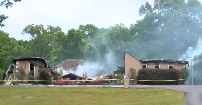 Smoke rises from the ashes of First Pentecostal Church of Holly Springs, Mississippi after it was burned down on May 20, 2020.