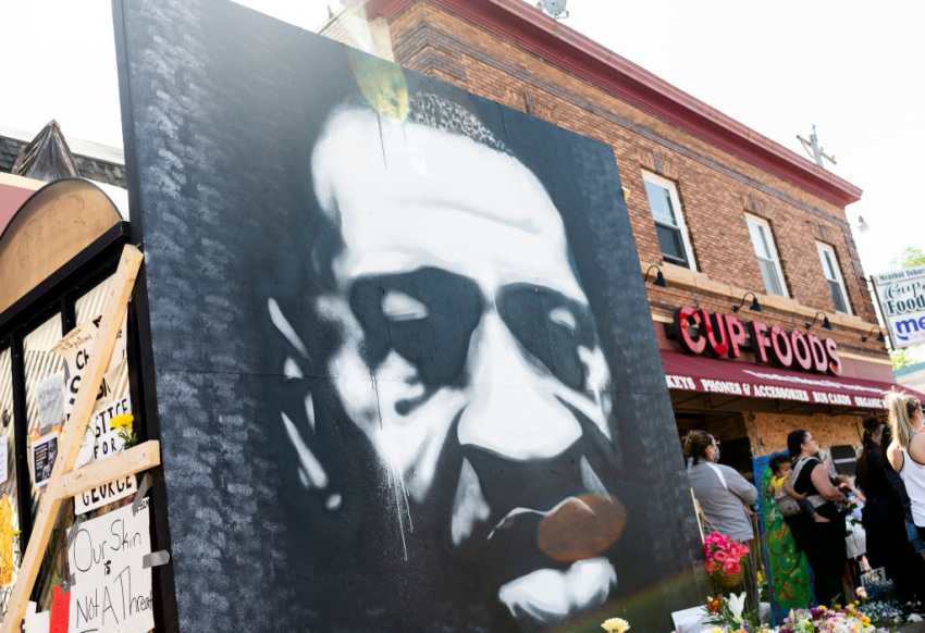 A large painting depicting the face of George Floyd stands at a memorial site outside Cup Foods on June 3, 2020, in Minneapolis, Minnesota.
