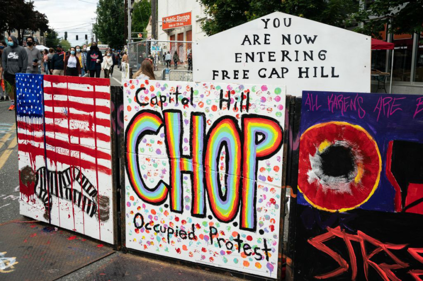 A sign reads "Capitol Hill Occupied Protest" in an area that has been referred to by protesters by that name as well as "Capitol Hill Organized Protest, or CHOP, on June 14, 2020, in Seattle, Washington. Black Lives Matter protesters have continued demonstrating in what was first referred to as the Capitol Hill Autonomous Zone, which encompasses several blocks around the Seattle Police Departments vacated East Precinct, but what protesters are now calling the "Capitol Hill Organized Protest."