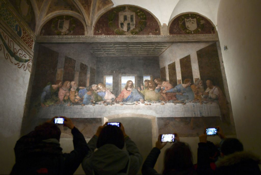 Visitors with their mobile phone take photos of 