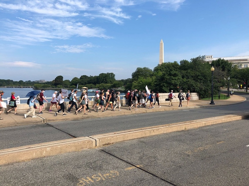 Participants in Walk the Walk 2020, a 130-mile pilgrimage from Charlottesville to Washington, march down to the National Mall in Washington D.C. for the Get Your Knee Off Our Necks Commitment March on Aug. 28, 2020.