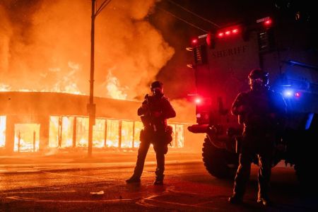 A police armored vehicle patrols an intersection on August 24, 2020 in Kenosha, Wisconsin during the second night of rioting after the shooting of Jacob Blake, 29, on August 23.