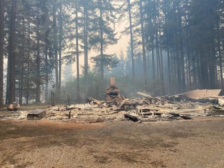 A chimney and fireplace are the only things standing at the site of the burned-down Dodge Community Church near Estacada, Oregon, which was destroyed by the Riverside Fire in September 2020.