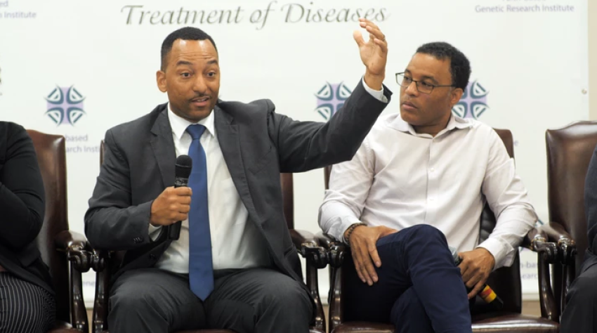 Tshaka Cunningham (L), is executive director of The Faith Based Genetic Research Institute, and co-founder and chief scientific officer of TruGenomix,