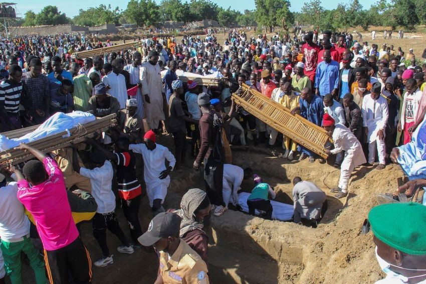 Mourners attend the funeral of 43 farm workers in Zabarmari, about 20km from Maiduguri, Nigeria, on November 29, 2020 after they were killed by Boko Haram fighters in rice fields near the village of Koshobe on November 28, 2020.