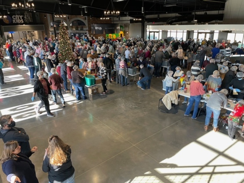 Volunteers from Hope City Church of Joplin, Missouri pack approximately 40,000 meals for the less fortunate on Sunday, Dec. 20, 2020.